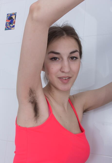 Lovely cutie Olina W revealing big titties and jerking off in bathroom